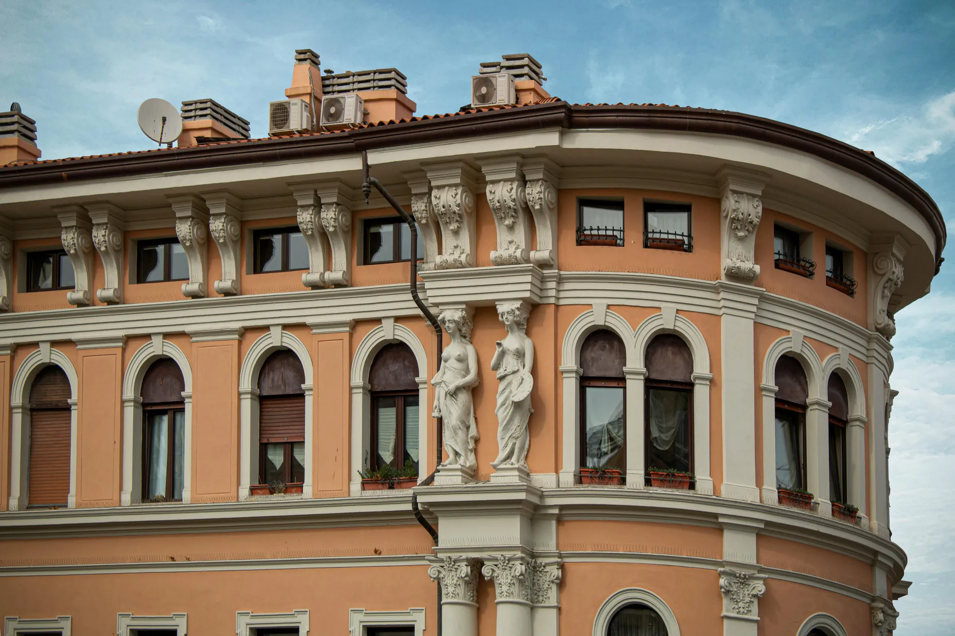 Close-up of classic Italian architecture in Trieste, showcasing historical design elements.